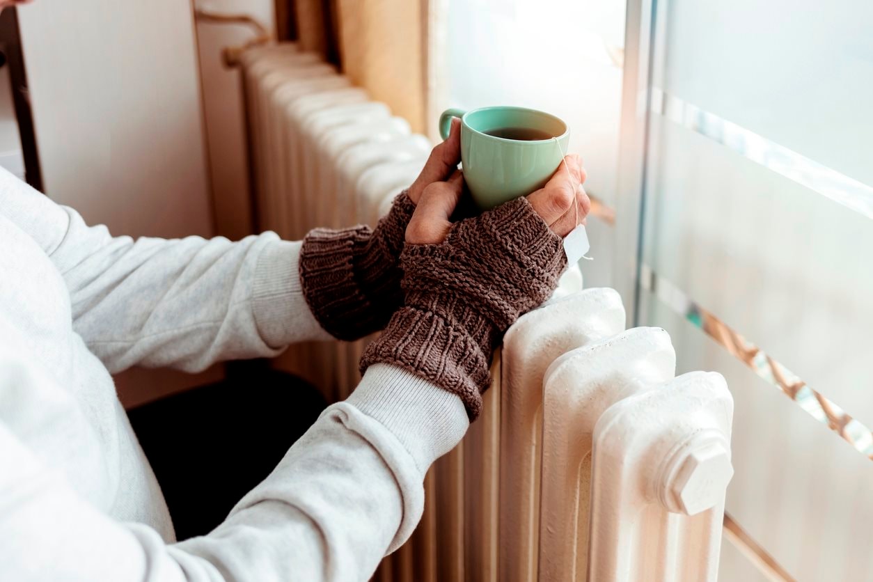 warming-hands-on-a-radiator.jpg